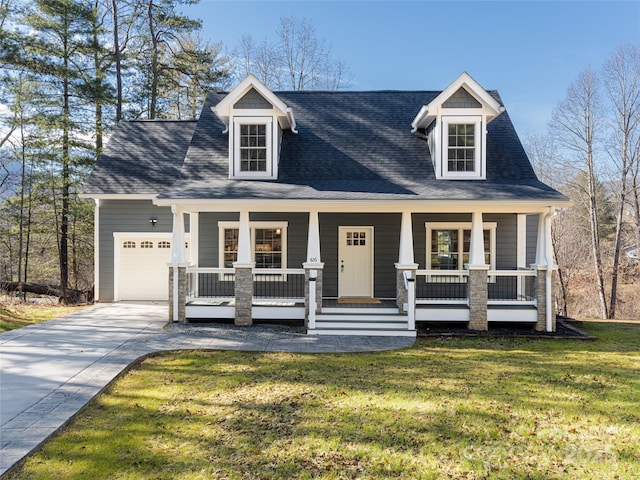 new england style home featuring a garage, covered porch, and a front lawn