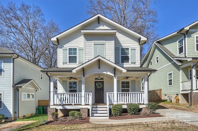 view of front of house with covered porch, ceiling fan, and a shingled roof