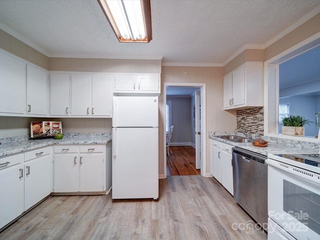 kitchen with sink, crown molding, light wood-type flooring, white appliances, and white cabinets