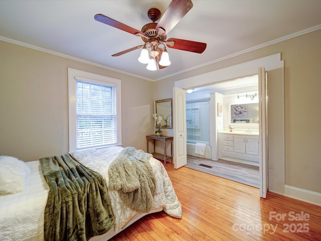 bedroom featuring wood-type flooring, ornamental molding, and ceiling fan