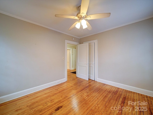 unfurnished room with ornamental molding, ceiling fan, and light wood-type flooring