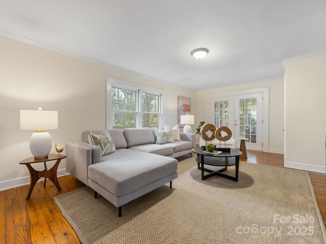 living room featuring french doors, ornamental molding, and wood-type flooring