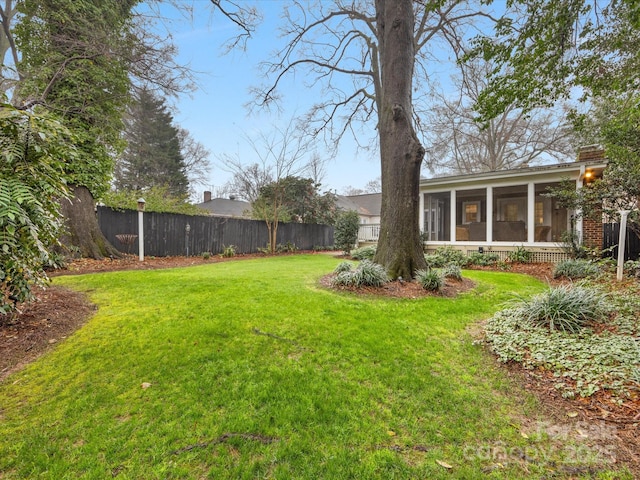 view of yard featuring a sunroom