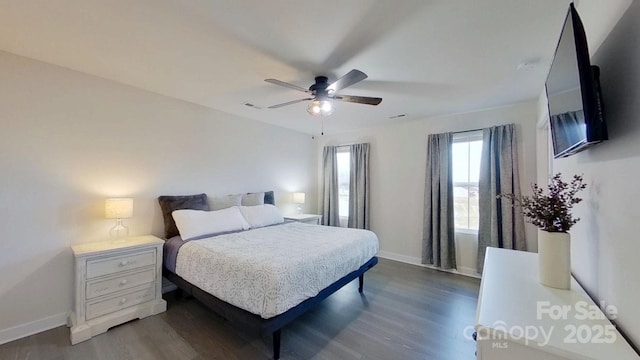 bedroom featuring ceiling fan and dark hardwood / wood-style flooring