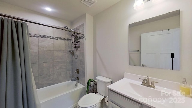 full bathroom featuring vanity, shower / bathtub combination with curtain, and toilet