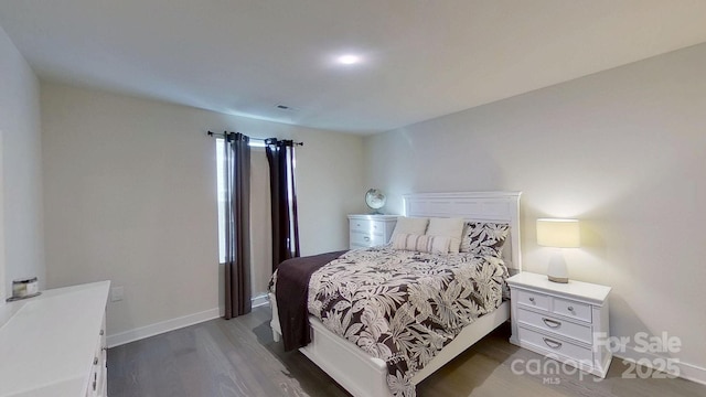 bedroom featuring dark hardwood / wood-style floors