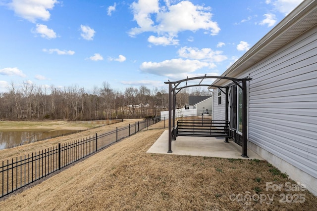 view of yard featuring a patio and a water view