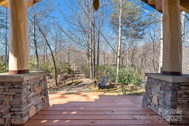 wooden terrace featuring covered porch