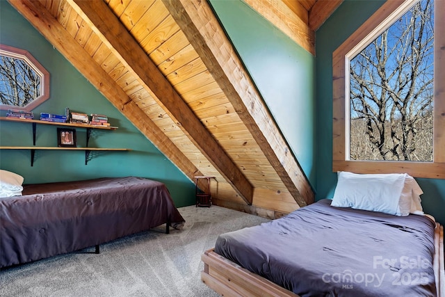 bedroom featuring vaulted ceiling with beams, wood ceiling, and carpet flooring