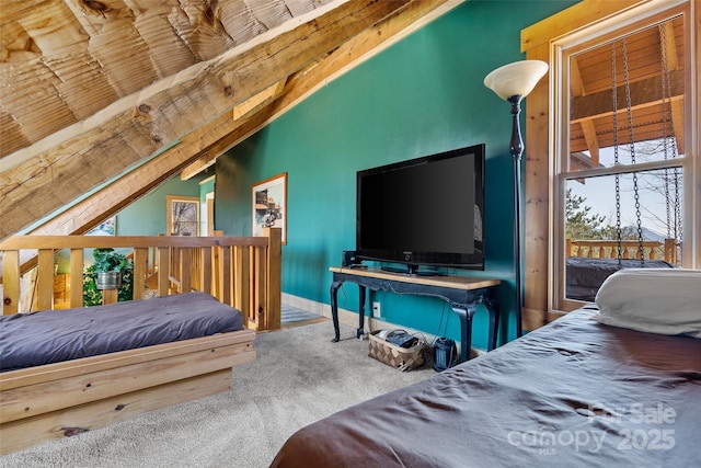 carpeted bedroom with lofted ceiling and access to outside