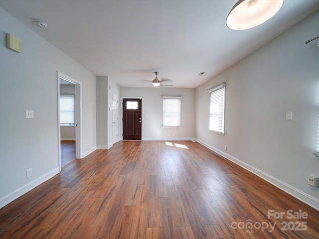 foyer featuring dark hardwood / wood-style flooring and ceiling fan