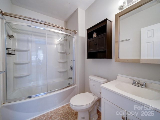 full bathroom with bath / shower combo with glass door, vanity, and toilet