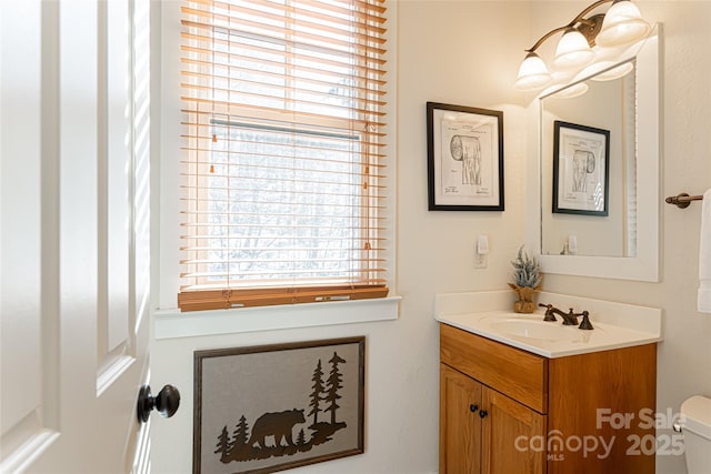 bathroom with vanity and toilet