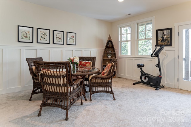 sitting room featuring light colored carpet