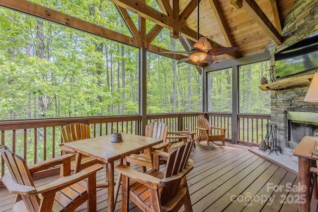 142 Allspice Ct, Tuckasegee, NC 28783 - sunroom / solarium featuring a fireplace, outdoor dining space, and ceiling fan
