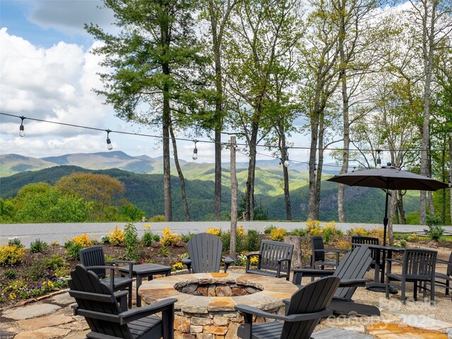142 Allspice Ct, Tuckasegee, NC 28783 - view of patio with an outdoor fire pit and a mountain view
