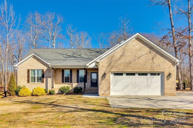 single story home featuring an attached garage, brick siding, driveway, and a front yard