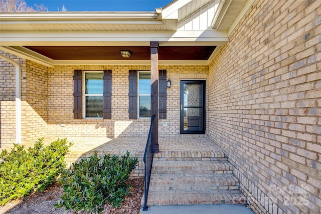 entrance to property with brick siding