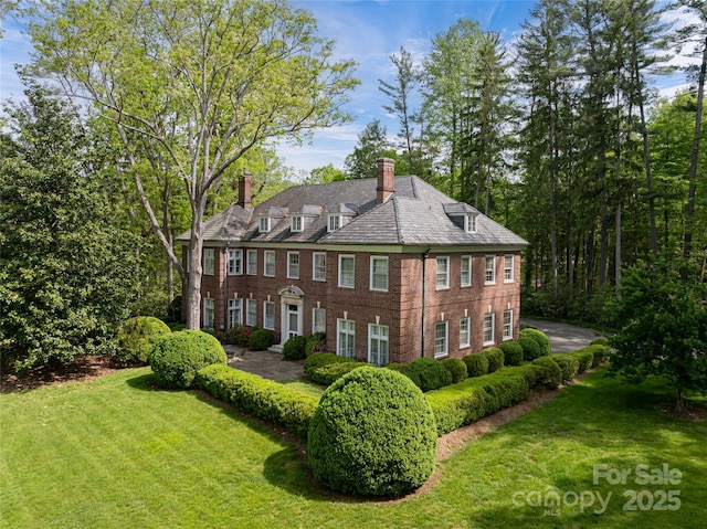 407 Vanderbilt Rd, Asheville, NC 28803 - exterior space with a yard, a high end roof, brick siding, and a chimney