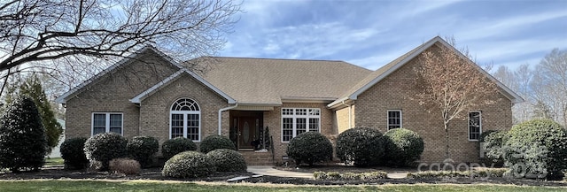 view of front of house featuring brick siding