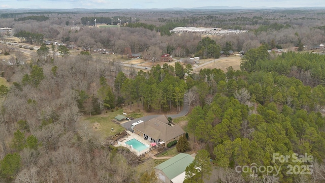 aerial view featuring a view of trees