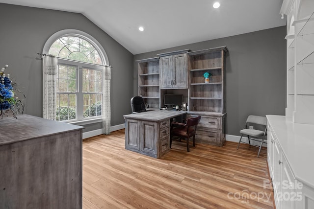 home office featuring light wood-style floors, recessed lighting, vaulted ceiling, and baseboards