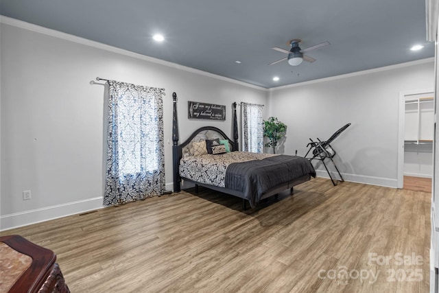 bedroom featuring crown molding, recessed lighting, wood finished floors, and baseboards