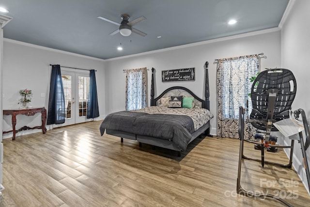 bedroom with crown molding, french doors, wood finished floors, and access to exterior