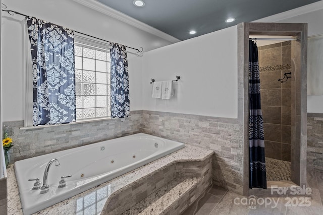 full bath with a stall shower, a jetted tub, crown molding, tile walls, and recessed lighting