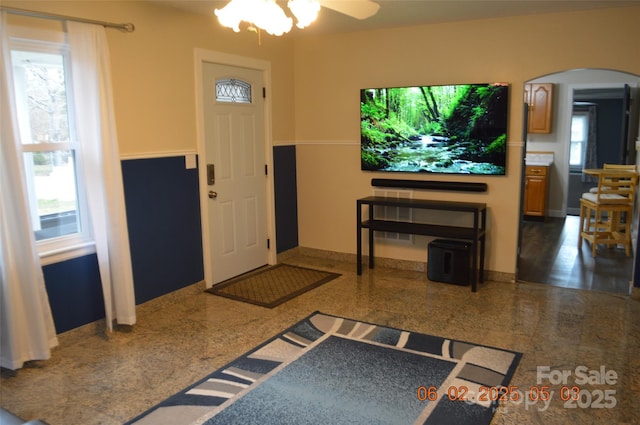 entryway featuring ceiling fan