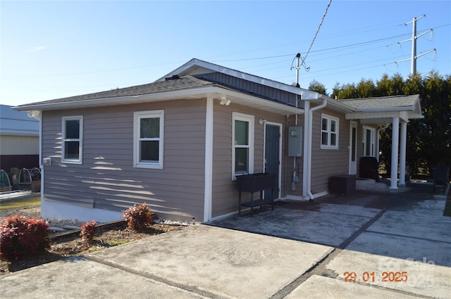 view of side of home featuring a patio