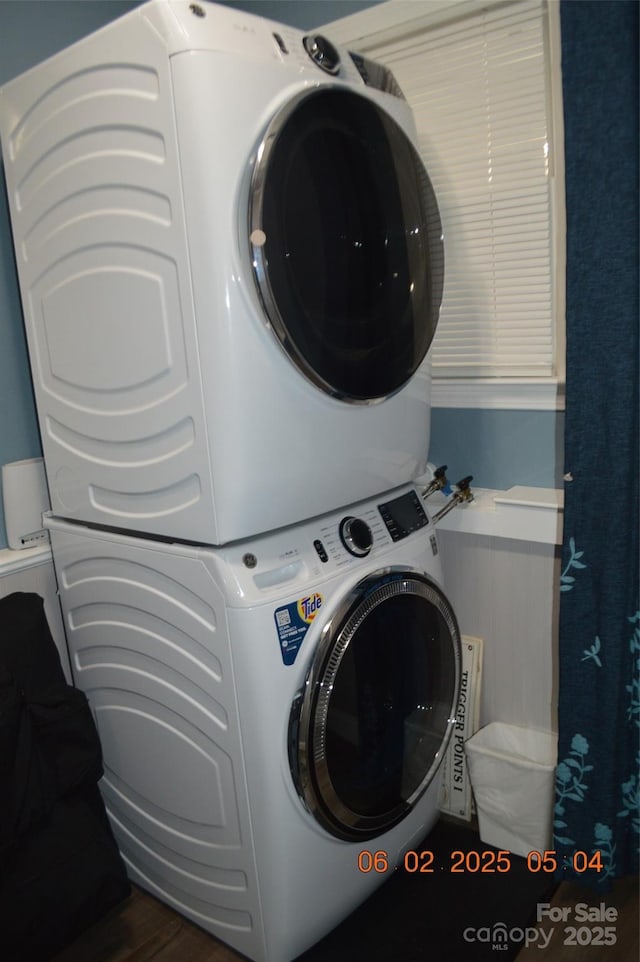 laundry room featuring stacked washer / dryer