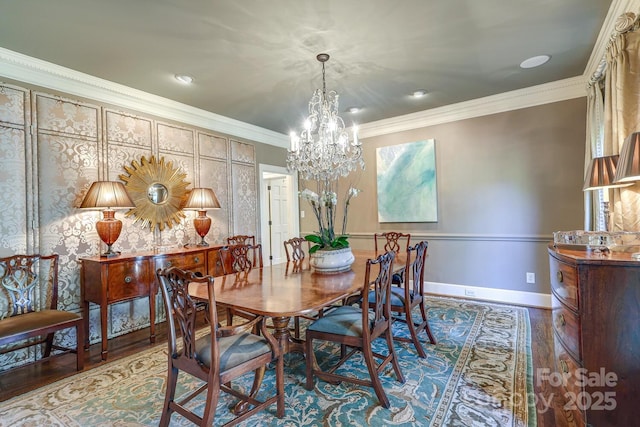 dining area with crown molding, a chandelier, and hardwood / wood-style floors