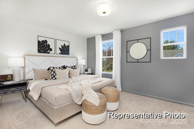 bedroom featuring light colored carpet