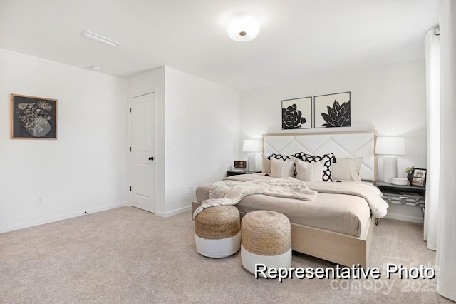 bedroom featuring light colored carpet