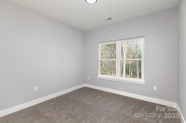 empty room with carpet flooring