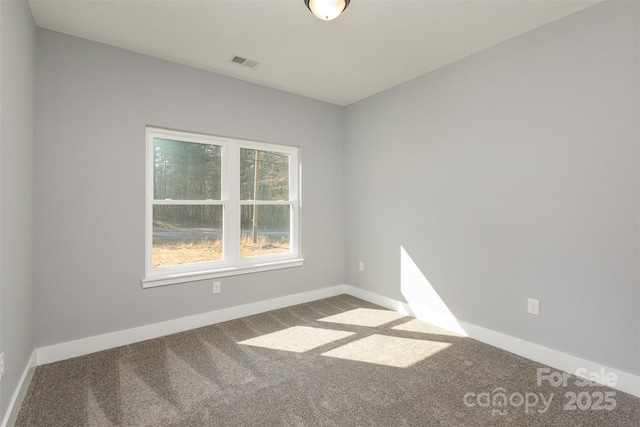 unfurnished room featuring carpet flooring