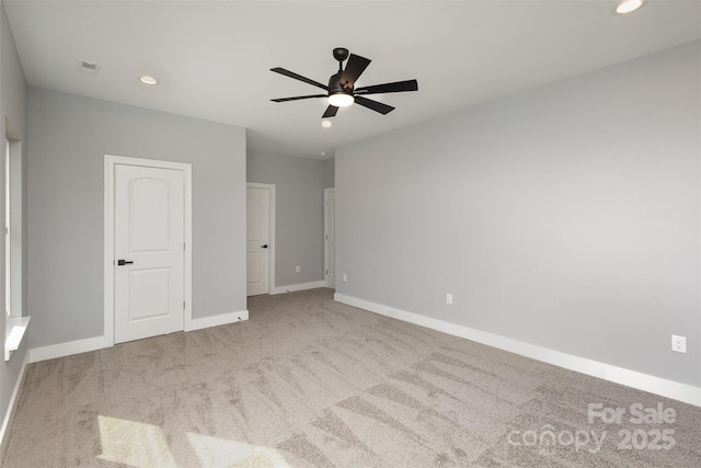 unfurnished bedroom with ceiling fan and light carpet