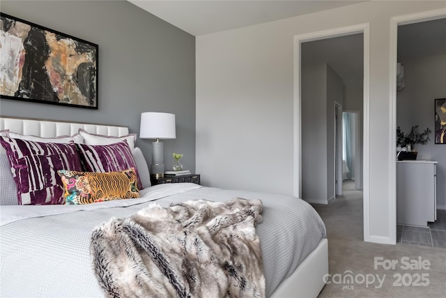 carpeted bedroom featuring baseboards