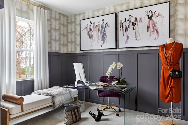 bedroom featuring wallpapered walls and a decorative wall