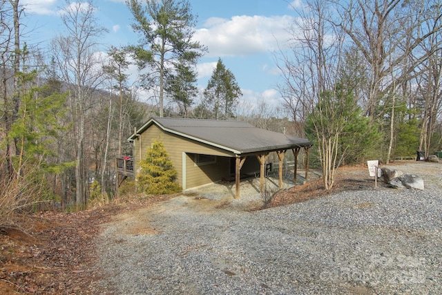 view of side of home featuring a carport