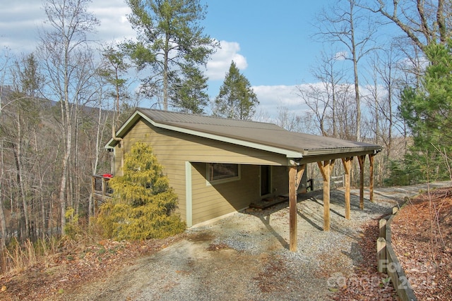 exterior space with a carport