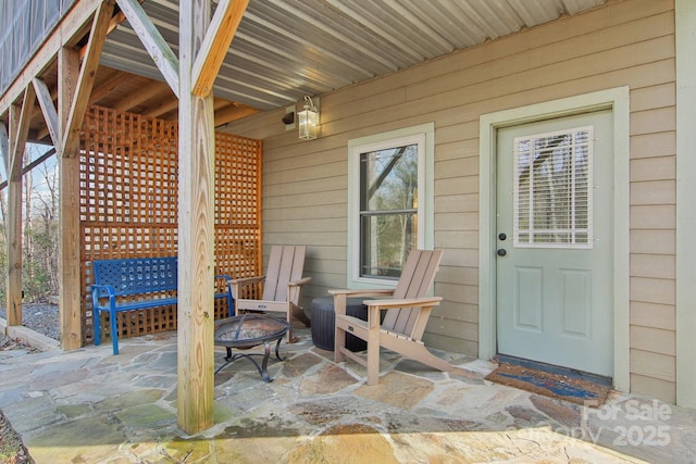 view of patio / terrace featuring an outdoor fire pit