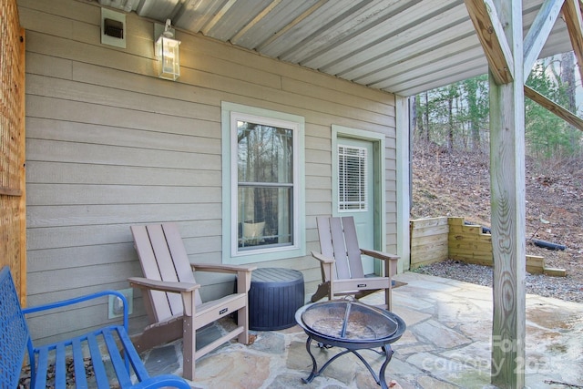 view of patio / terrace featuring central AC and a fire pit