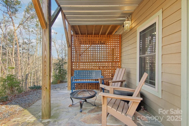 view of patio / terrace with a fire pit