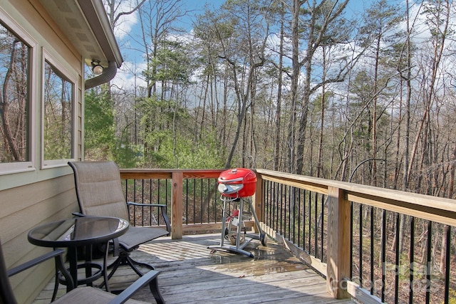 wooden deck featuring a wooded view