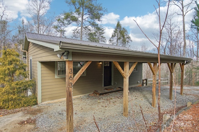 exterior space with driveway and a carport