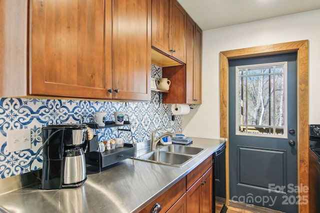 kitchen featuring stainless steel countertops, decorative backsplash, brown cabinetry, a sink, and dishwasher