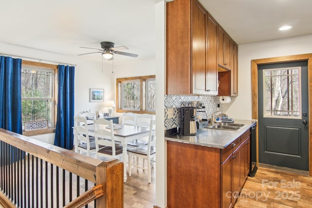 363 Luther Burbank Dr, Lake Lure, NC 28746 - kitchen with stainless steel countertops, light wood-style floors, backsplash, ceiling fan, and recessed lighting