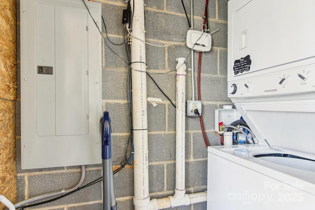 363 Luther Burbank Dr, Lake Lure, NC 28746 - utility room featuring electric panel and stacked washer / drying machine